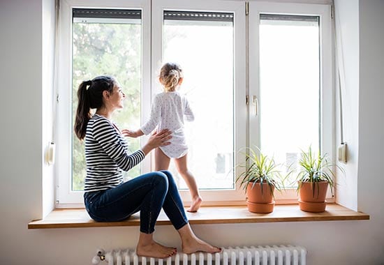 child looking out of new windows