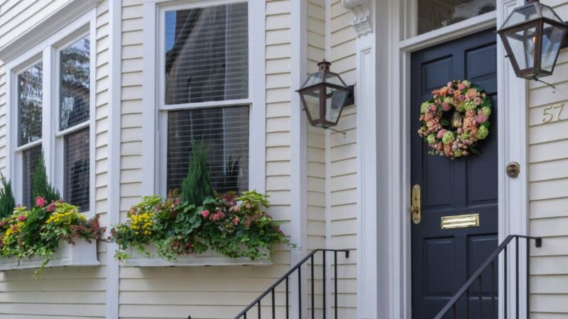 Front Of House With Blue Door And Flower Wreath