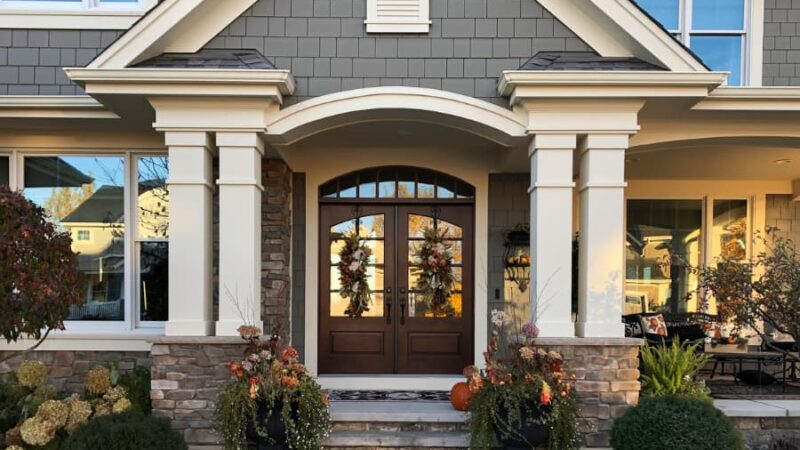 Large Double Exterior Doors Surrounded By Pillars