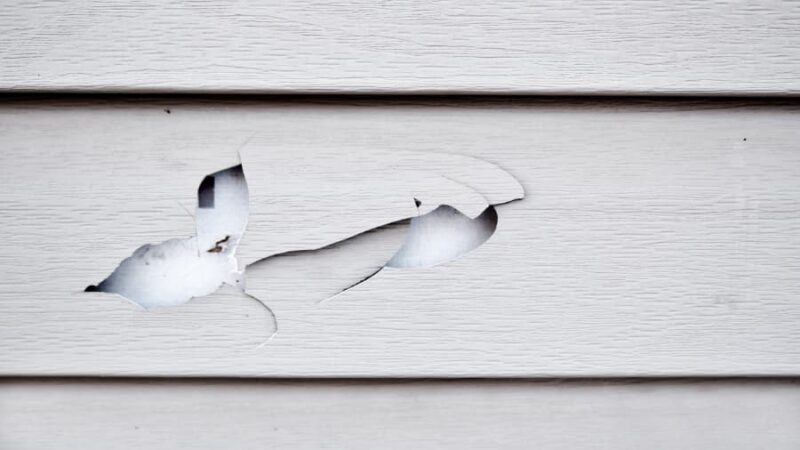 Vinyl siding with holes and cracks