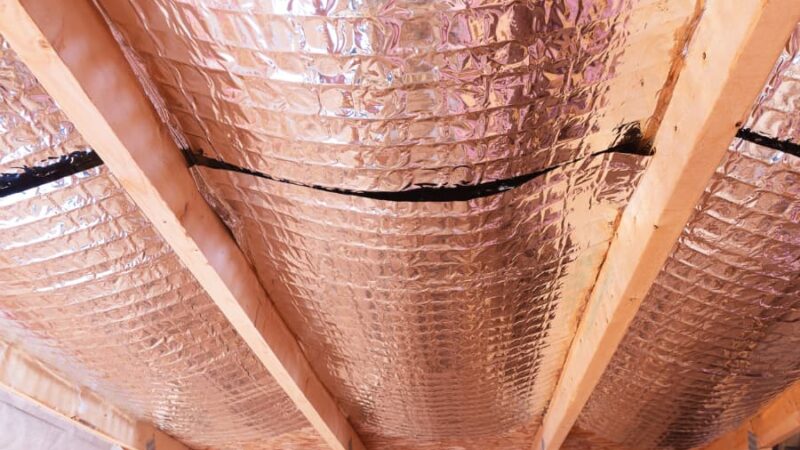 Radiant heat barriers between attic joists