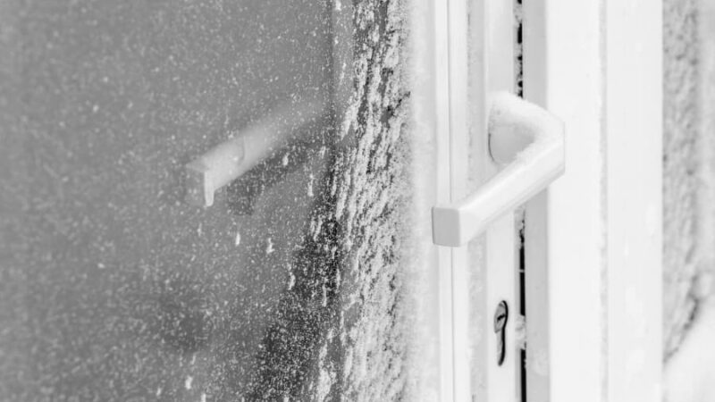 Storm door and handle covered by snow