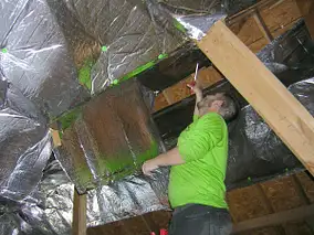 Man inspecting attic