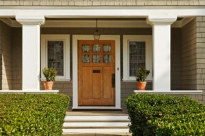 A beautiful replacement wooden front door completes a welcoming porch.