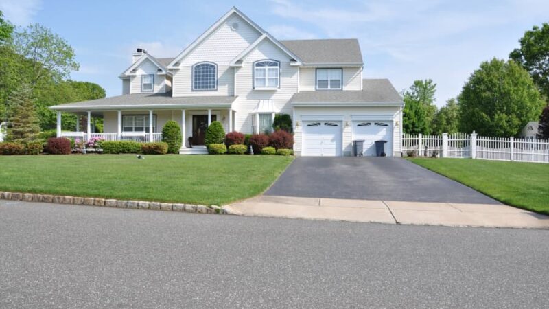 Beautiful two-story suburban home seen from the curb