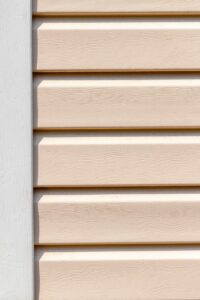 Close-up of beige composite siding on a home 