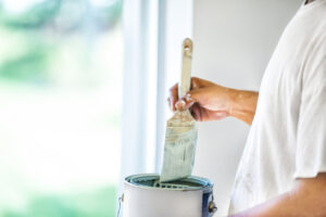 DIY homeowner mixing paint to apply to vinyl windows