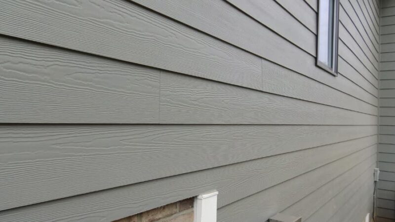 Home undergoing replacement siding services
