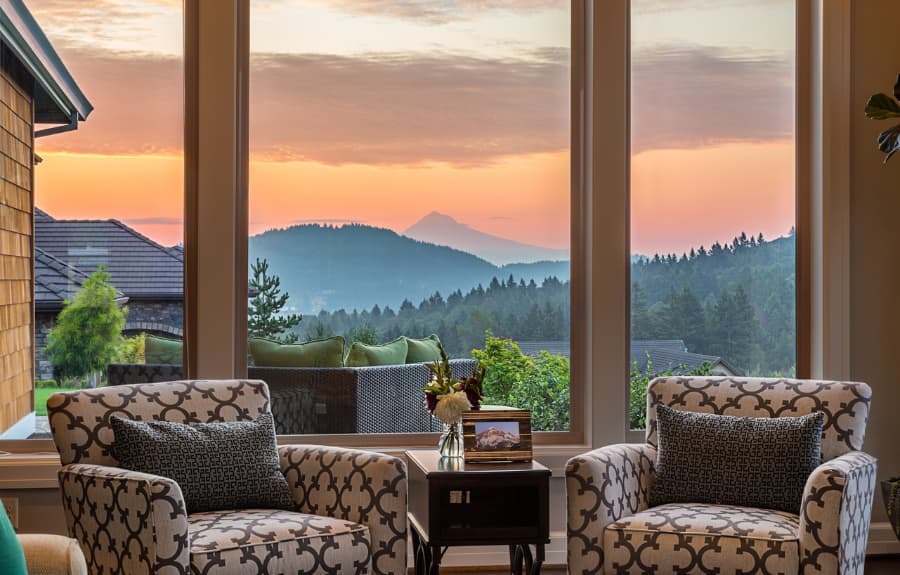 living-room-with-picture-window-overlooking-sunrise-and-mountain-backdrop Picture