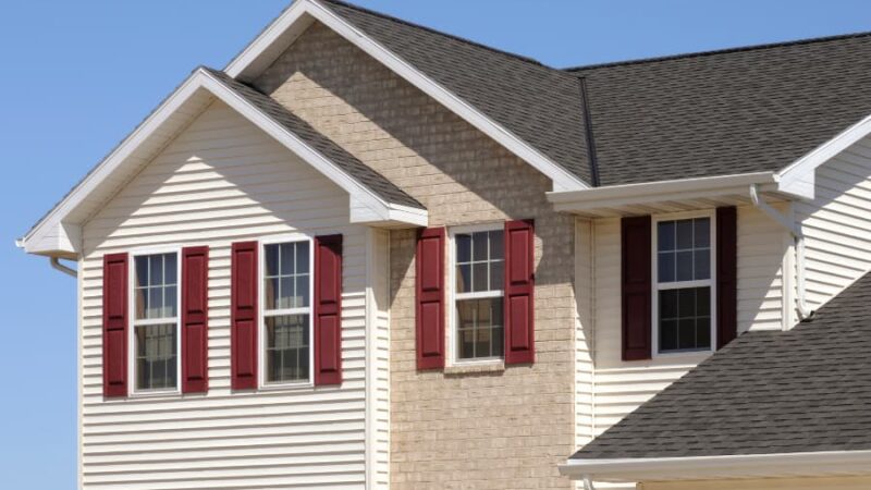 Siding and shutters in contrasting colors create curb appeal
