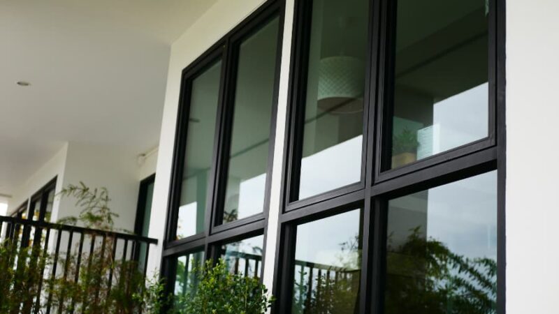 Home with light walls and black window frames