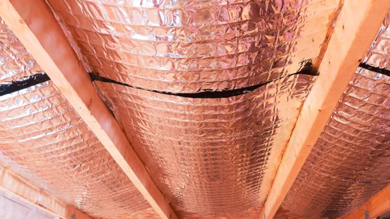 Reflective radiant barrier installed in home attic